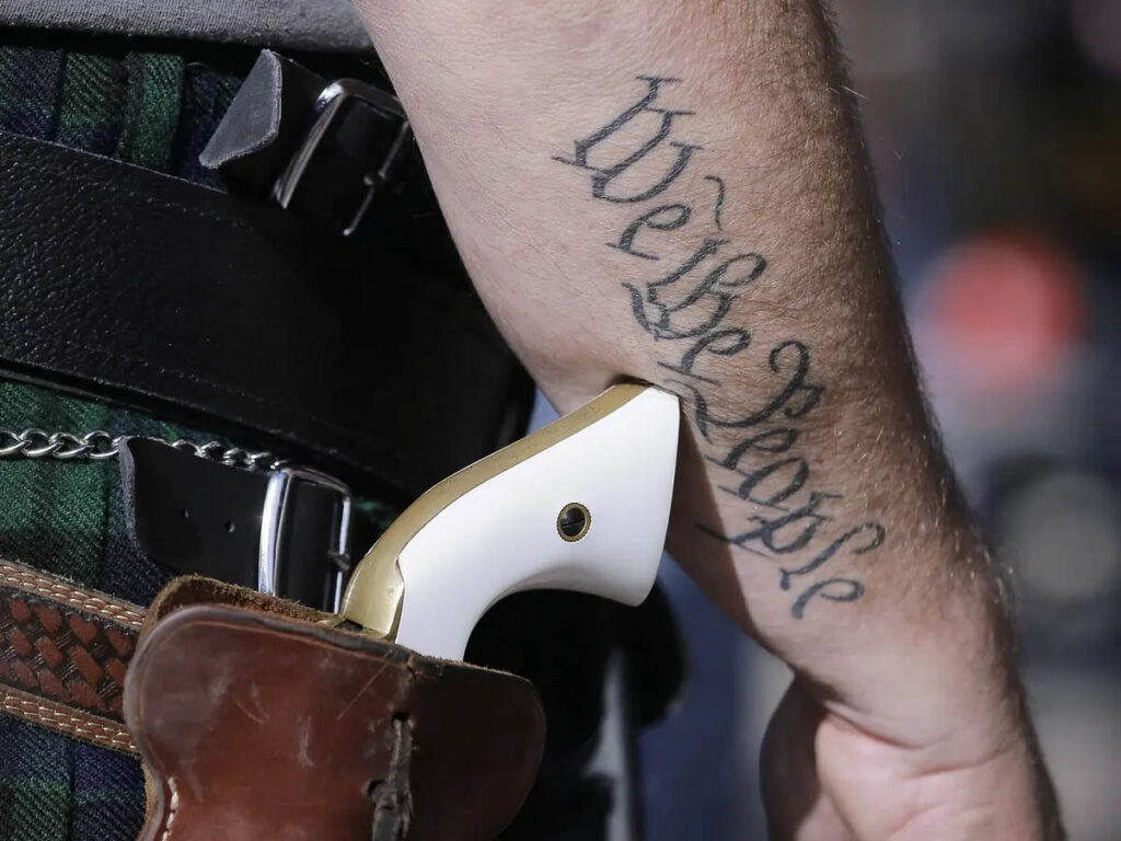 Guns and White Supremacy -  White man with holstered gun