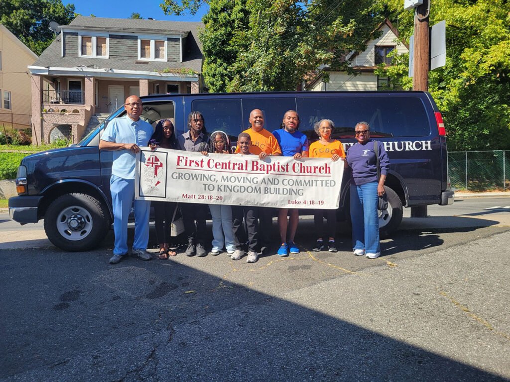Dr. Carolina (center) joins First Central members as they prepare to march in the 2025 Staten Island Black Heritage Day Parade